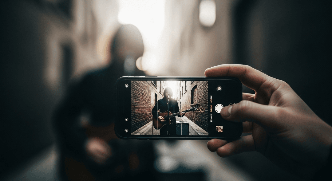 Smartphone filming a musician, illustrating how to shoot a music video with an iPhone and achieve creative music video ideas on a budget.